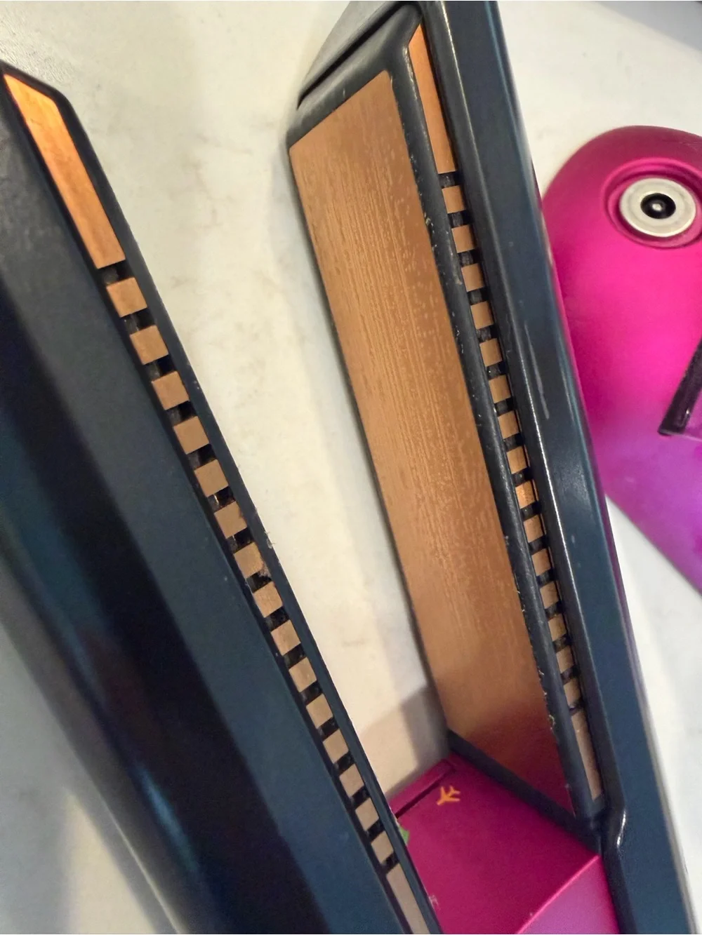 Dyson hair straightener in black and pink